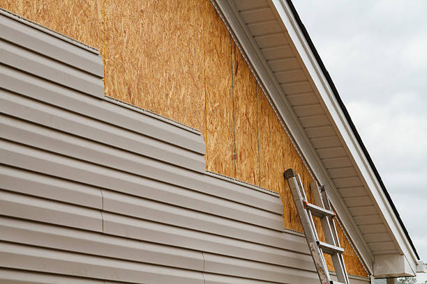 Professional Siding Installation technician working in Greenville, NY